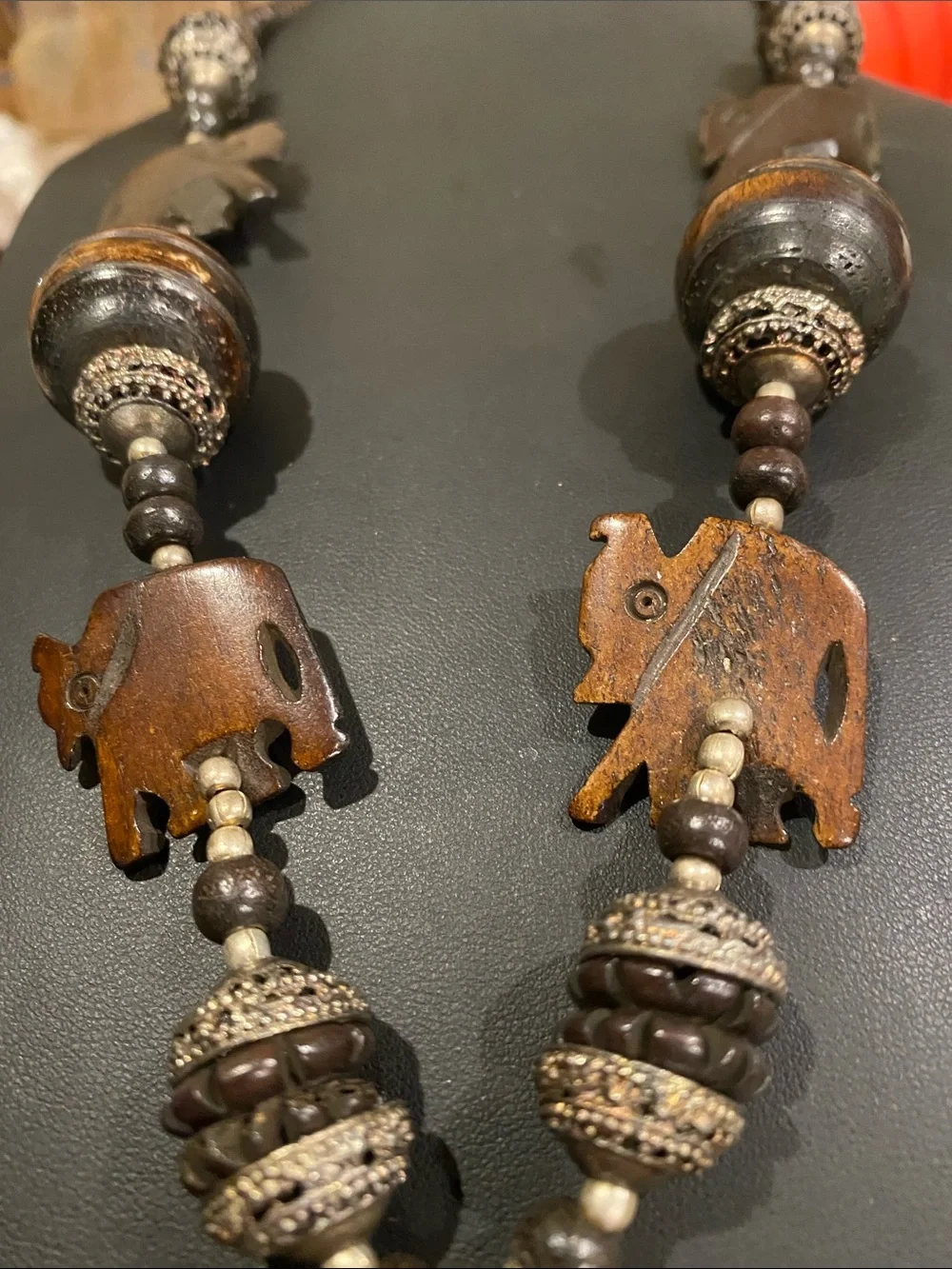 Handcrafted Elephant Pendant Necklace - Brown. Small elephants are bone.